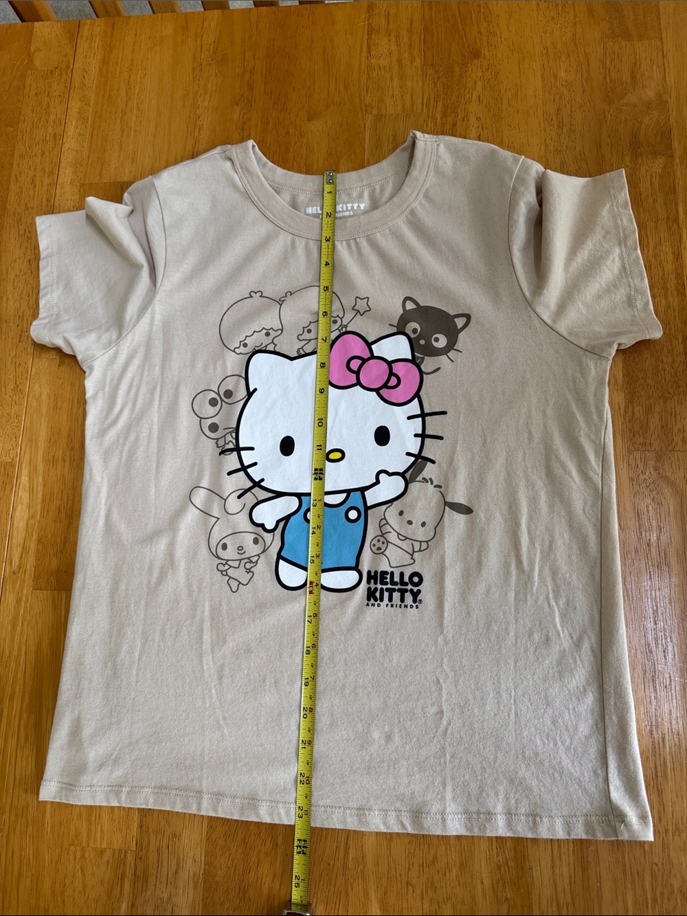 Hello Kitty Beige Graphic T-shirt Tee with Pink Bow and Blue Outfit - Picture 6 of 6